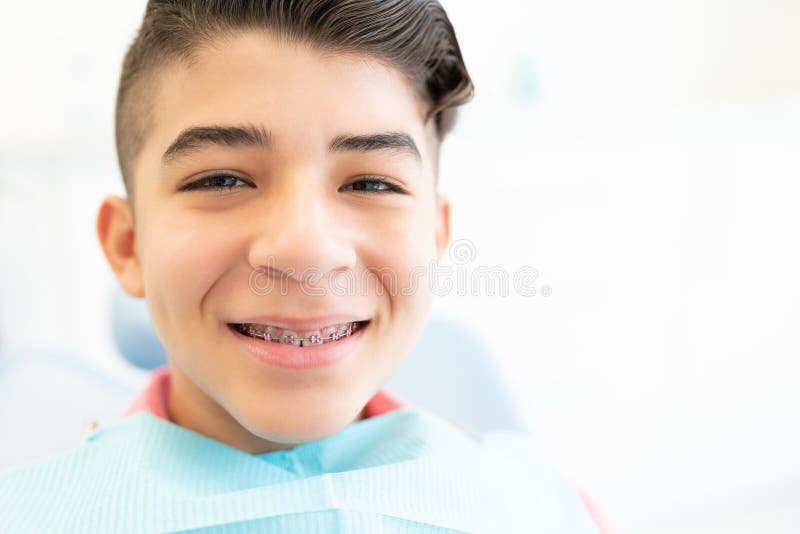 Closeup portrait of smiling Hispanic teenage boy wearing braces. Closeup portrait of smiling Hispanic teenage boy wearing braces