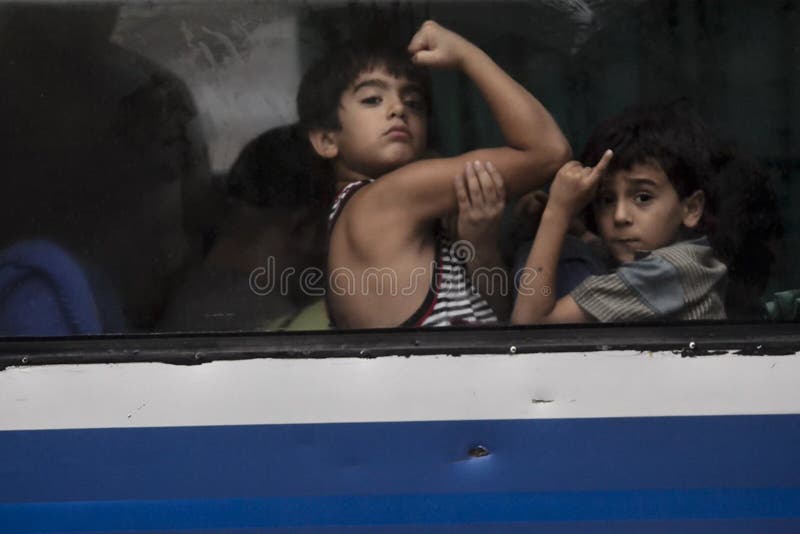 Two illegal immigrant boy from Middle East that were arrested by Indonesian officials, after they illegally entered Indonesia on the way to Australia for political asylum. They were arrested with other 44 immigrants at Karanganyar, Java, Indonesia. Two illegal immigrant boy from Middle East that were arrested by Indonesian officials, after they illegally entered Indonesia on the way to Australia for political asylum. They were arrested with other 44 immigrants at Karanganyar, Java, Indonesia.