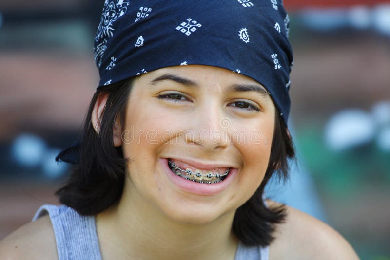 Young caucasian child with braces and a cool bandanna. Young caucasian child with braces and a cool bandanna.