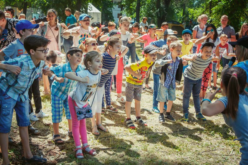 Zaporizhia/Ukraine- June 2, 2018: children – boys and girls participating at dancing activity on family charity festival in a city park. Outdoors entertainment for kids. Zaporizhia/Ukraine- June 2, 2018: children – boys and girls participating at dancing activity on family charity festival in a city park. Outdoors entertainment for kids.