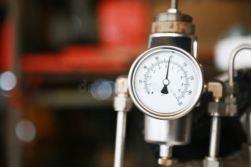 Pressure gauge using measure the pressure in production process. Worker or Operator monitoring oil and gas process by the gauge for routine record and analysis oil and gas production process. Pressure gauge using measure the pressure in production process. Worker or Operator monitoring oil and gas process by the gauge for routine record and analysis oil and gas production process.