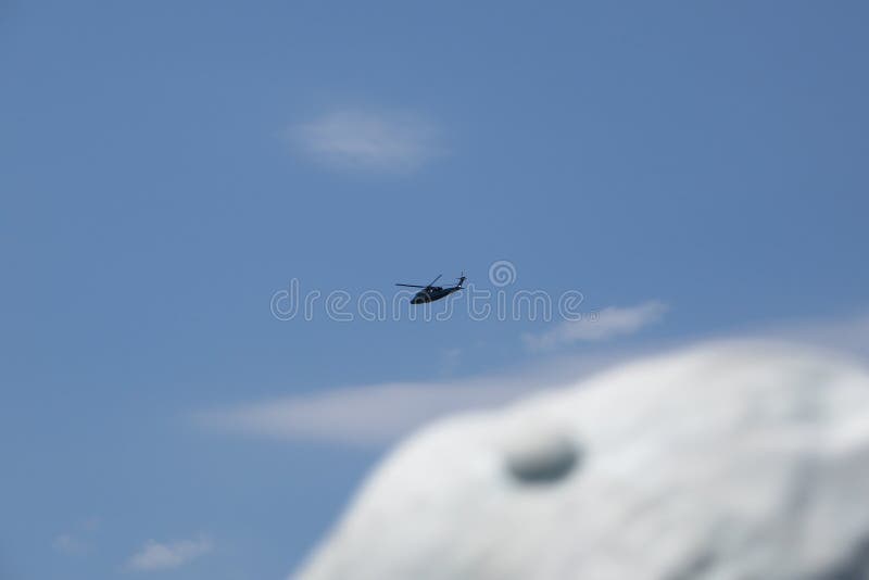 Manhattan, New York. August 1, 2019. Editorial photo of a Police helicopter flying in New York near a big cloud. Manhattan, New York. August 1, 2019. Editorial photo of a Police helicopter flying in New York near a big cloud.