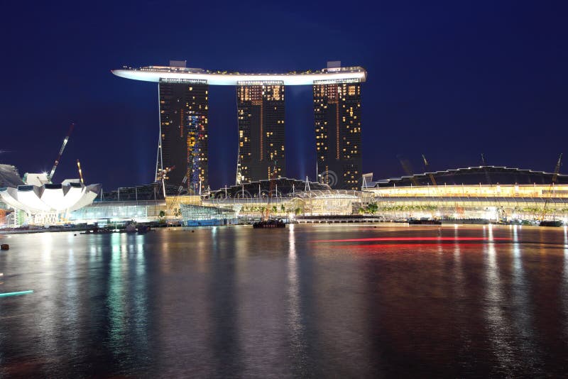 Marina Bay Sands Integrated Resort /Casino with shopping mall at night,Singapore, view from merlion park. Marina Bay Sands Integrated Resort /Casino with shopping mall at night,Singapore, view from merlion park.