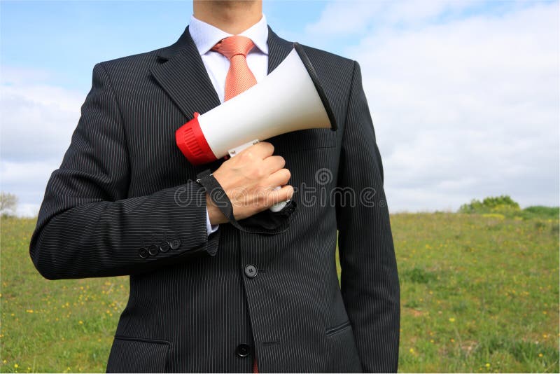 Businessman holding a megaphone ready to give an order. Businessman holding a megaphone ready to give an order