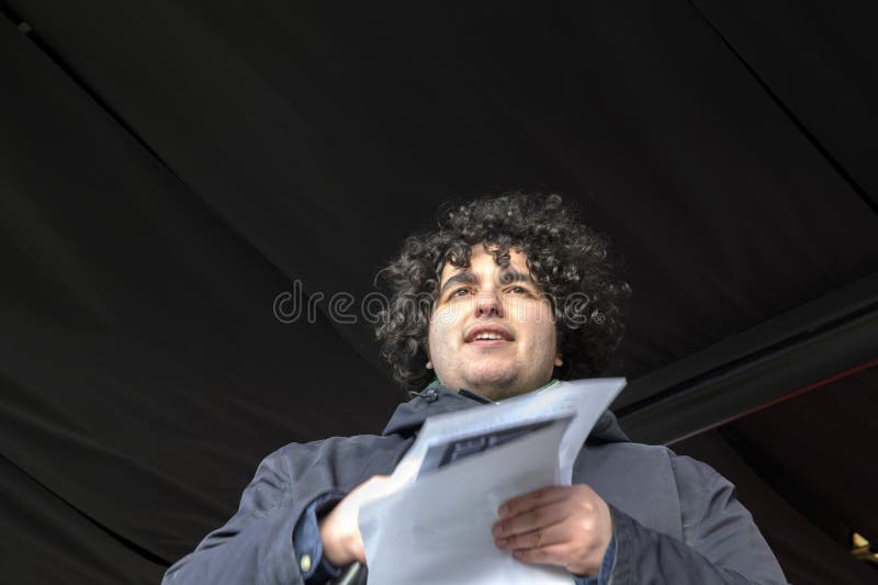 Mert Kumru Speaking To The Crowd At The Niet Mijn Schuld Demonstration At Amsterdam The Netherlands 5-2-2022. Mert Kumru Speaking To The Crowd At The Niet Mijn Schuld Demonstration At Amsterdam The Netherlands 5-2-2022.