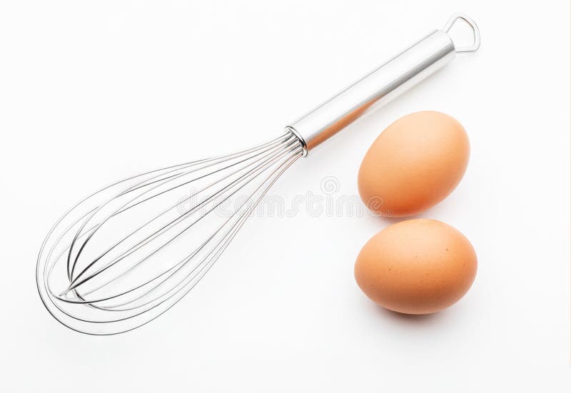 Metallic kitchen rods for manually mixing food with 2 fresh eggs collection of cooking objects. Isolated on white background. Metallic kitchen rods for manually mixing food with 2 fresh eggs collection of cooking objects. Isolated on white background