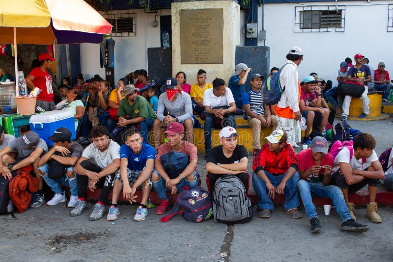 A group of about 300 Hondurans, part of the First Migrant Caravan of 2020 coming out of Honduras, is seen resting at the entrance of the Rodolfo Robles bridge, the international border between Mexico and Guatemala, as they arrive after entering and crossing this Central American country, January 17, 2020. As thousands of Central American and Extracontinental migrants try to make their way from their home countries towards the United States in search of the so called â€œAmerican Dream, local authorities ramp up security and try to stern the immigration flow, due to threats made by U.S. President Donald Trump, to cut aid funding and money to countries that organize Migrant Caravans, as this phenomenon, that started in late 2018, keeps going in a new way for migrants to travel safely and save money, by traveling grouped together in large quantities, in a massive exodus and influx in immigration. A group of about 300 Hondurans, part of the First Migrant Caravan of 2020 coming out of Honduras, is seen resting at the entrance of the Rodolfo Robles bridge, the international border between Mexico and Guatemala, as they arrive after entering and crossing this Central American country, January 17, 2020. As thousands of Central American and Extracontinental migrants try to make their way from their home countries towards the United States in search of the so called â€œAmerican Dream, local authorities ramp up security and try to stern the immigration flow, due to threats made by U.S. President Donald Trump, to cut aid funding and money to countries that organize Migrant Caravans, as this phenomenon, that started in late 2018, keeps going in a new way for migrants to travel safely and save money, by traveling grouped together in large quantities, in a massive exodus and influx in immigration.