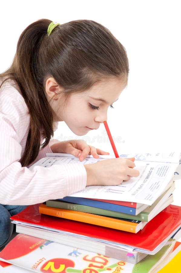 Cute girl concentrated homework writing. Cute girl concentrated homework writing