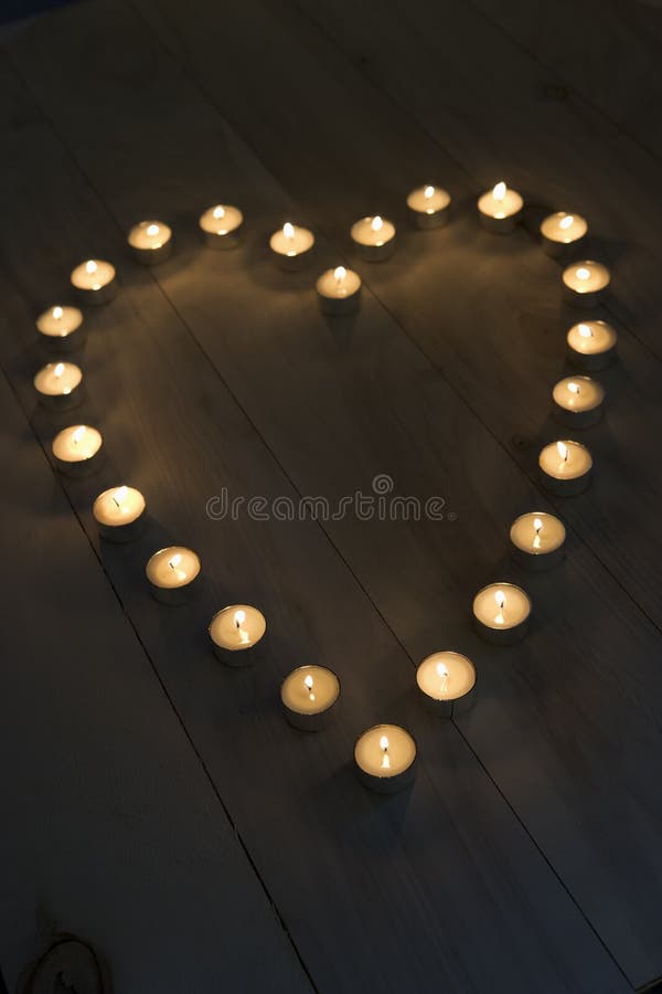 Illuminated Candles Placed In A Heart Shape. Illuminated Candles Placed In A Heart Shape.