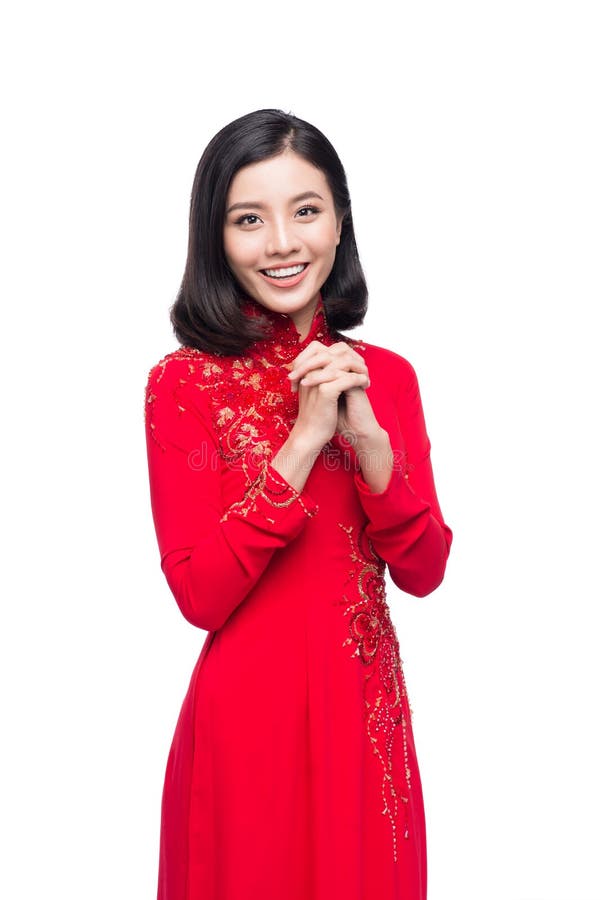 Молодая въетнамская женщина в платье Ao Dai с моля желанием жеста стоковые изображения rf