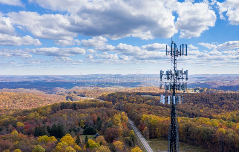 Aerial view of mobiel phone cell tower over forested rural area of West Virginia to illustrate lack of broadband internet service. Aerial view of mobiel phone cell tower over forested rural area of West Virginia to illustrate lack of broadband internet service