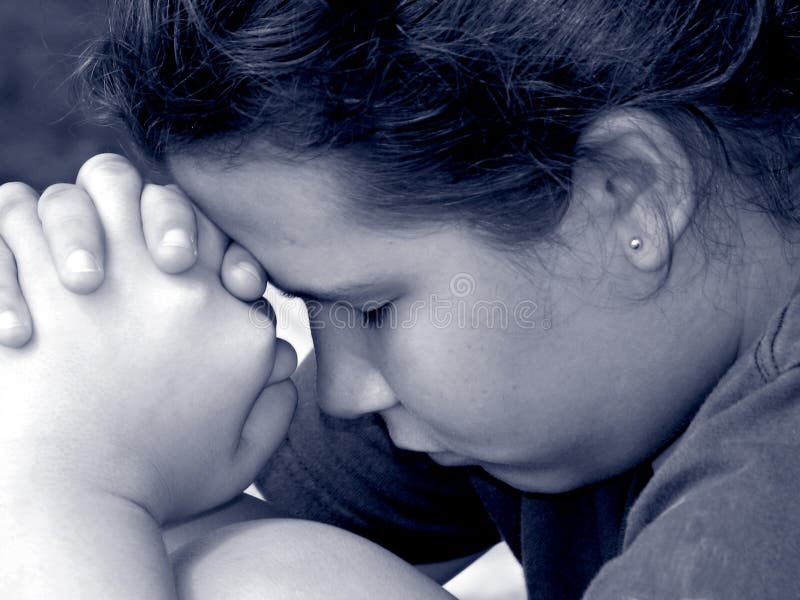 Closeup of a girl in prayer in black and white. Closeup of a girl in prayer in black and white