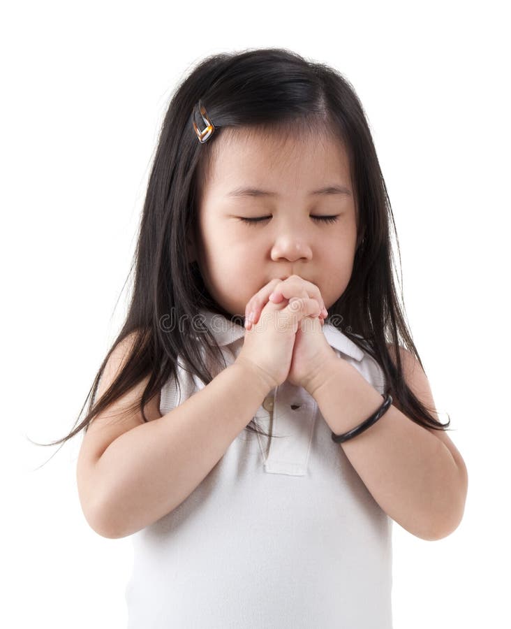 Little girl praying on white background. Little girl praying on white background