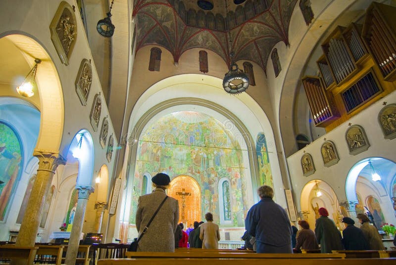 People gathered in prayer at a Catholic church in Bucharest, Romania. People gathered in prayer at a Catholic church in Bucharest, Romania.