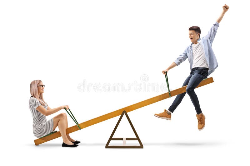 Молодая женщина и подросток на seesaw стоковая фотография Молодая женщина и подросток на seesaw стоковая фотография