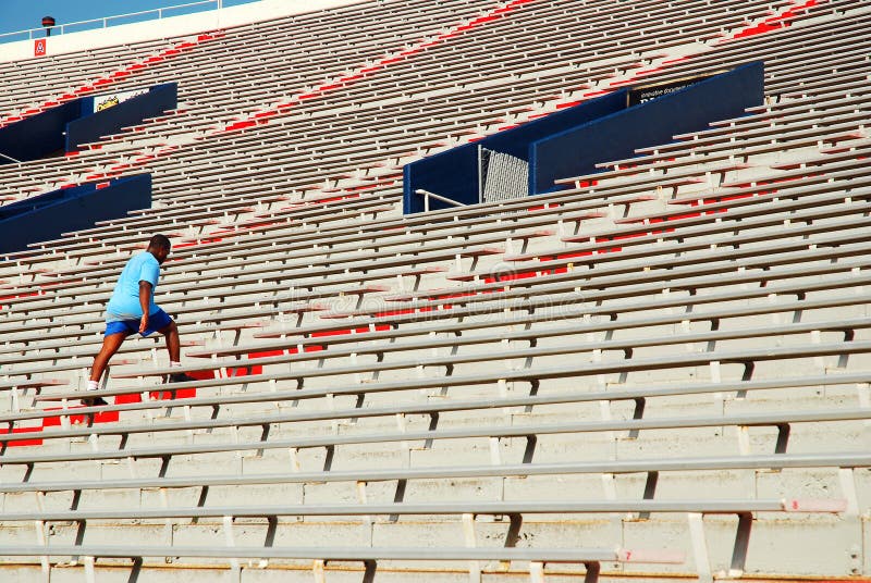 A young athlete uses the steps of the Vaught Hemmingway Stadium at the University of Mississippi as part of his exercise routine. A young athlete uses the steps of the Vaught Hemmingway Stadium at the University of Mississippi as part of his exercise routine