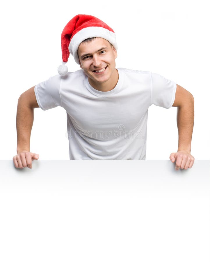 Молодой человек в шлеме Santa Claus стоковое изображение rf Молодой человек в шлеме Santa Claus стоковое изображение rf