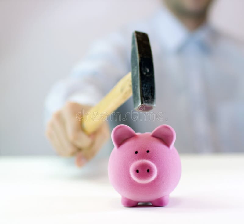 Pink piggy bank and hand with hammer. Pink piggy bank and hand with hammer