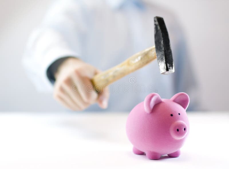 Pink piggy bank and hand with hammer. Pink piggy bank and hand with hammer