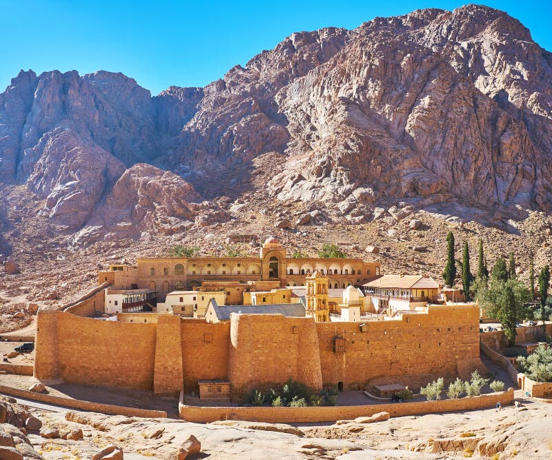 The medieval fortified monastery of St Catherine, located at the foot of the rocky mount in the same named town, Sinai, Egypt. The medieval fortified monastery of St Catherine, located at the foot of the rocky mount in the same named town, Sinai, Egypt.