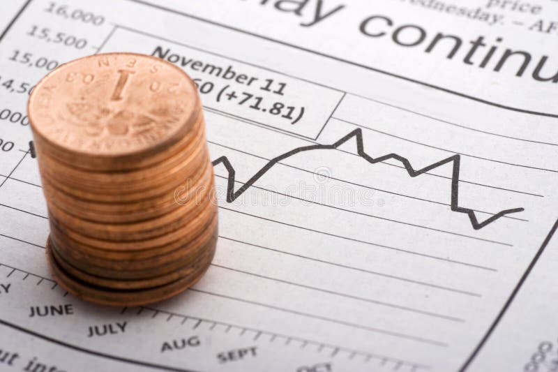 Coins Over Charts close up. Coins Over Charts close up