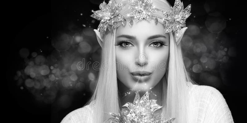 Monochrome Attractive Elf Queen with Silver Christmas Poinsettia Flowers Sending a Kiss. Monochrome Attractive Elf Queen with Silver Christmas Poinsettia Flowers Sending a Kiss.