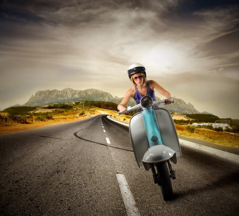 Girl driving old moped on a countryroad. Girl driving old moped on a countryroad