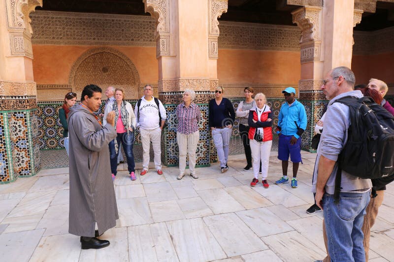 Moroccan Tourist Guide giving information about palace to Tourists.December 10,2015 in Morocco. Moroccan Tourist Guide giving information about palace to Tourists.December 10,2015 in Morocco.