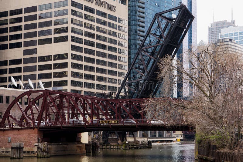 The Kinzie Street railroad bridge, a single leaf bscule bridge across the north branch of the Chicago River in downtown Chicago, Illinois, is permanently locked in the raised position. The Kinzie Street railroad bridge, a single leaf bscule bridge across the north branch of the Chicago River in downtown Chicago, Illinois, is permanently locked in the raised position