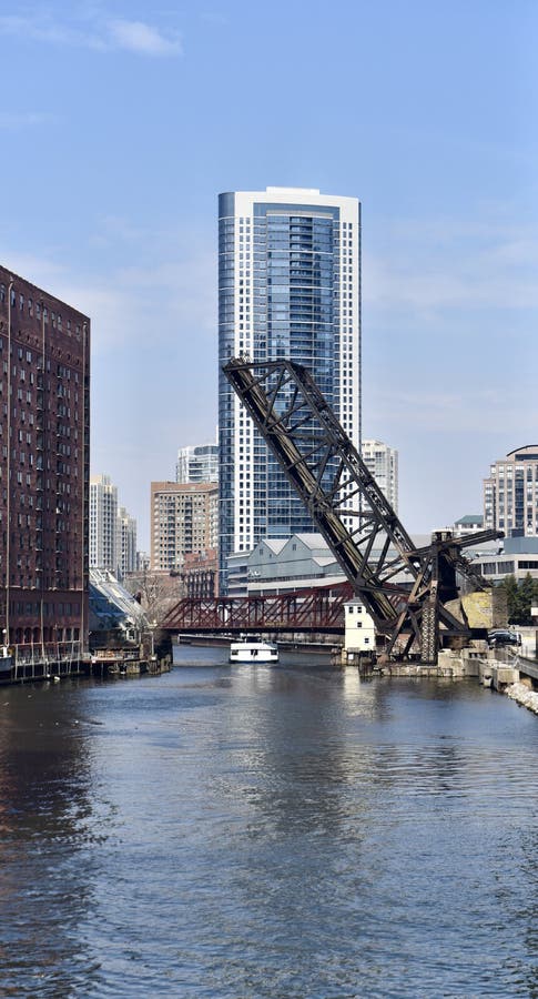 This is an early Spring picture of the historic Kinzie Street Railroad Bridge Over the North Branch of the Chicago River located in Chicago, Illinois in Cook County. The Kinzie Street Bridge opened on September 19, 1908 as the world’s longest Bascule Bridge at 195.8 feet long. The bridge although listed as active has been permanently in the raised position since 2000. The Kinzie Street Bridge was declared a Chicago Landmark in 2000. This picture was taken on April 11, 2018. This is an early Spring picture of the historic Kinzie Street Railroad Bridge Over the North Branch of the Chicago River located in Chicago, Illinois in Cook County. The Kinzie Street Bridge opened on September 19, 1908 as the world’s longest Bascule Bridge at 195.8 feet long. The bridge although listed as active has been permanently in the raised position since 2000. The Kinzie Street Bridge was declared a Chicago Landmark in 2000. This picture was taken on April 11, 2018.