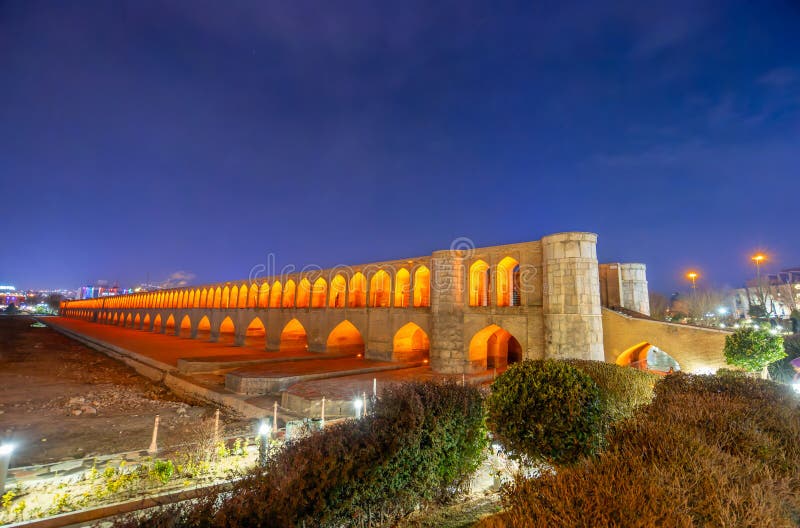 The Bridge of 33 Arches, also known as Allahverdi Khan Bridge, looks even more beautiful under the lights at night. Isfahan, Iran. The Bridge of 33 Arches, also known as Allahverdi Khan Bridge, looks even more beautiful under the lights at night. Isfahan, Iran.