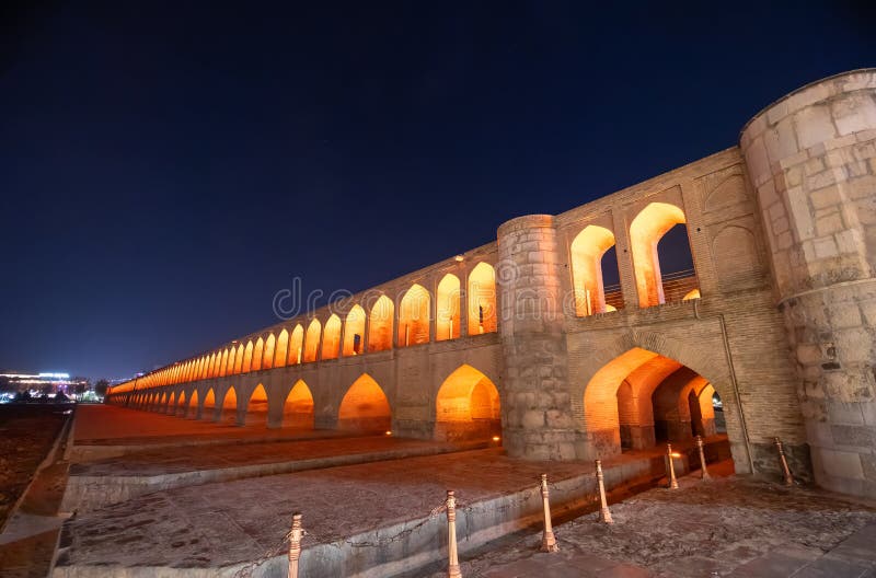 The Bridge of 33 Arches, also known as Allahverdi Khan Bridge, looks even more beautiful under the lights at night. Isfahan, Iran. The Bridge of 33 Arches, also known as Allahverdi Khan Bridge, looks even more beautiful under the lights at night. Isfahan, Iran.