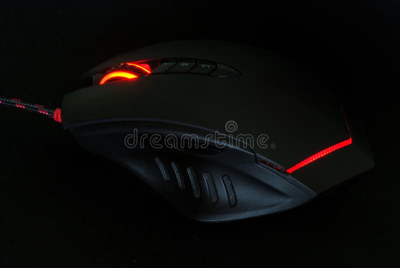 Мышь игры компьютера красного света в темном тоне стоковое фото rf Мышь игры компьютера красного света в темном тоне стоковое фото rf
