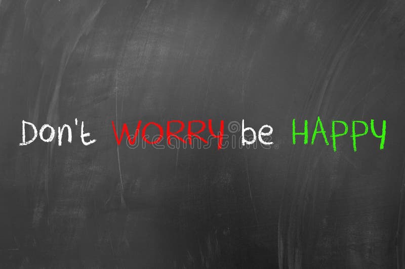 Don't worry be happy concept on blackboard. Don't worry be happy concept on blackboard