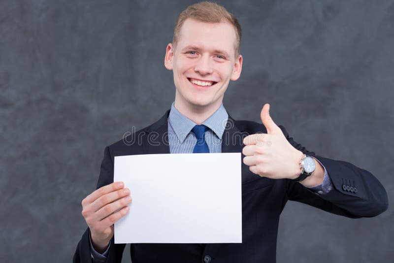 Shot of a young smiling man showing thumbs up. Shot of a young smiling man showing thumbs up