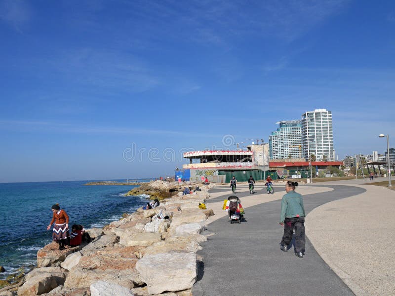 Tel Aviv`s waterfront combines a beach and recreational trail for cyclists and runners with rows of high rise hotels and apartment buildings. Tel Aviv`s waterfront combines a beach and recreational trail for cyclists and runners with rows of high rise hotels and apartment buildings