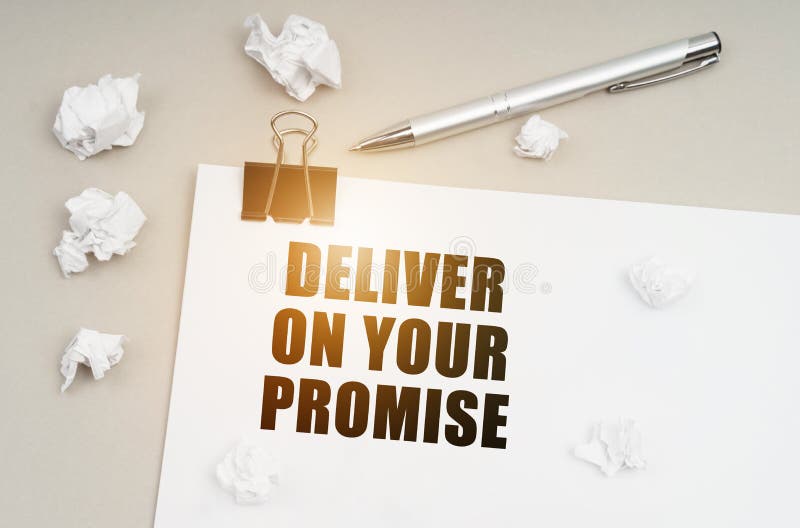 Economy and business concept. On a gray surface, a pen, crumpled paper and a sheet with the inscription - Deliver On Your Promise. Economy and business concept. On a gray surface, a pen, crumpled paper and a sheet with the inscription - Deliver On Your Promise