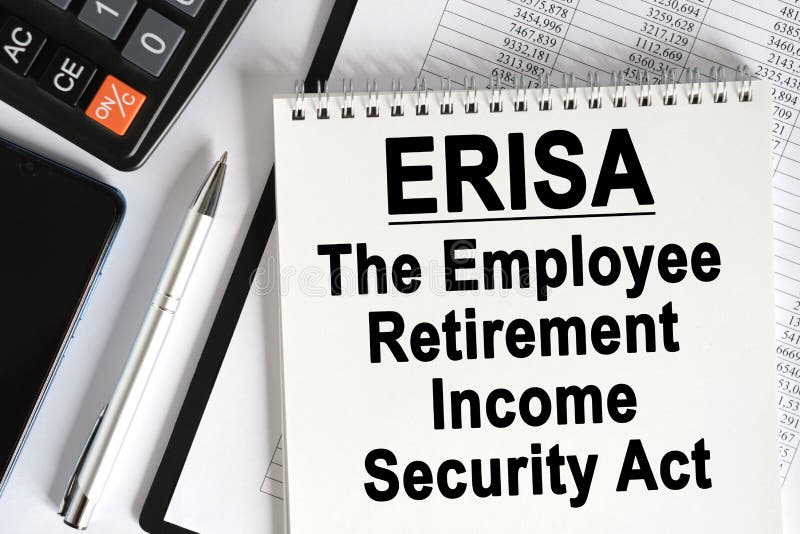 На столе лежит смартфон калькулятор и ноутбук с erisa надписи стоковое фото rf