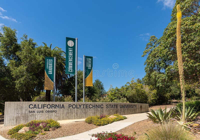 San Luis Obispo, CA, USA - June 7 2021: California Polytechnic State University. Name and banners on street at entrance to campus under blue sky. Green foliage as backdrop. San Luis Obispo, CA, USA - June 7 2021: California Polytechnic State University. Name and banners on street at entrance to campus under blue sky. Green foliage as backdrop