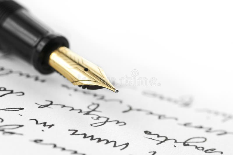 Gold pen with hand written letter. Focus on end tip of fountain pen. Gold pen with hand written letter. Focus on end tip of fountain pen.