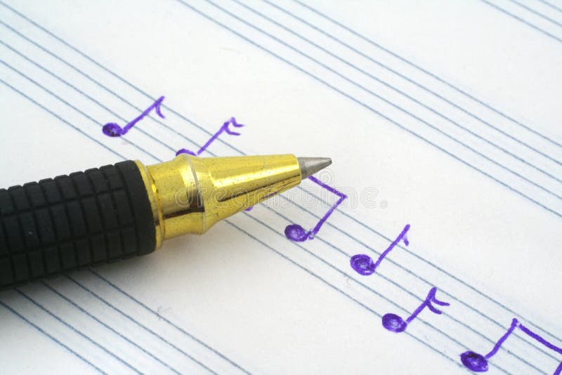 Close-up of hand written music note and ballpoint pen tip. Close-up of hand written music note and ballpoint pen tip