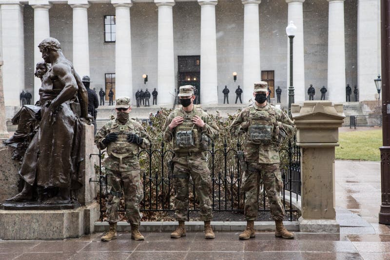 Police and Ohio National Guard stand behind barriers erected ahead of an armed rally days before Joe Biden`s inauguration. Security was enhanced after the insurrection that took place at the United States Capitol building. Columbus, Oh. January 17th, 2021. Police and Ohio National Guard stand behind barriers erected ahead of an armed rally days before Joe Biden`s inauguration. Security was enhanced after the insurrection that took place at the United States Capitol building. Columbus, Oh. January 17th, 2021