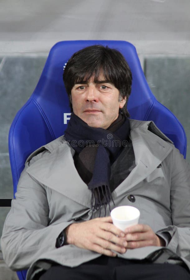 KYIV, UKRAINE - NOVEMBER 11, 2011: Germany national team head coach Joachim Low looks on during friendly game against Ukraine at NSK Olimpic stadium on November 11, 2011 in Kyiv, Ukraine. KYIV, UKRAINE - NOVEMBER 11, 2011: Germany national team head coach Joachim Low looks on during friendly game against Ukraine at NSK Olimpic stadium on November 11, 2011 in Kyiv, Ukraine