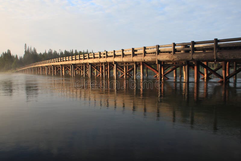 Fishing Bridge crowns the northern tip of Yellowstone Lake, the country's largest high-elevation lake at a little more than 7,700 feet.Fishing Bridge gains its name from a 1902 bridge that once served as Yellowstone's most popular angling location. During Yellowstone's early history crowds of fishermen would inundate this small fishing hole, which was popular for cutthroat trout. Fishing is now limited to catch and release recreation.A National Historic Landmark building that is now a prototype for many NPS visitor facilities across the country houses the area's visitor center and a bird museum. Fishing Bridge crowns the northern tip of Yellowstone Lake, the country's largest high-elevation lake at a little more than 7,700 feet.Fishing Bridge gains its name from a 1902 bridge that once served as Yellowstone's most popular angling location. During Yellowstone's early history crowds of fishermen would inundate this small fishing hole, which was popular for cutthroat trout. Fishing is now limited to catch and release recreation.A National Historic Landmark building that is now a prototype for many NPS visitor facilities across the country houses the area's visitor center and a bird museum.