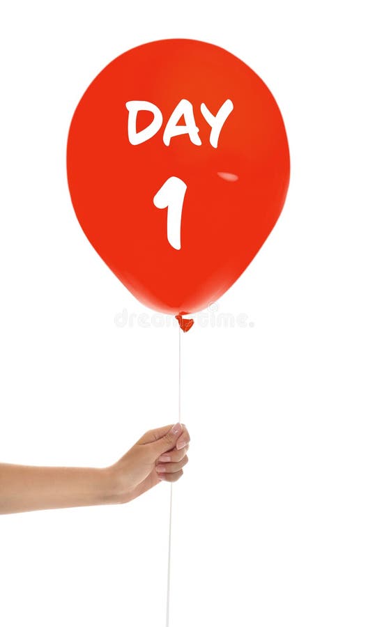 Starting new life chapter. Woman holding red balloon with text Day 1 on white background, closeup. Starting new life chapter. Woman holding red balloon with text Day 1 on white background, closeup