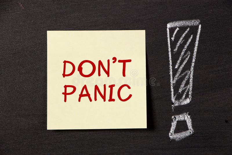 Don't Panic note with big exclamation mark on blackboard. Don't Panic note with big exclamation mark on blackboard.