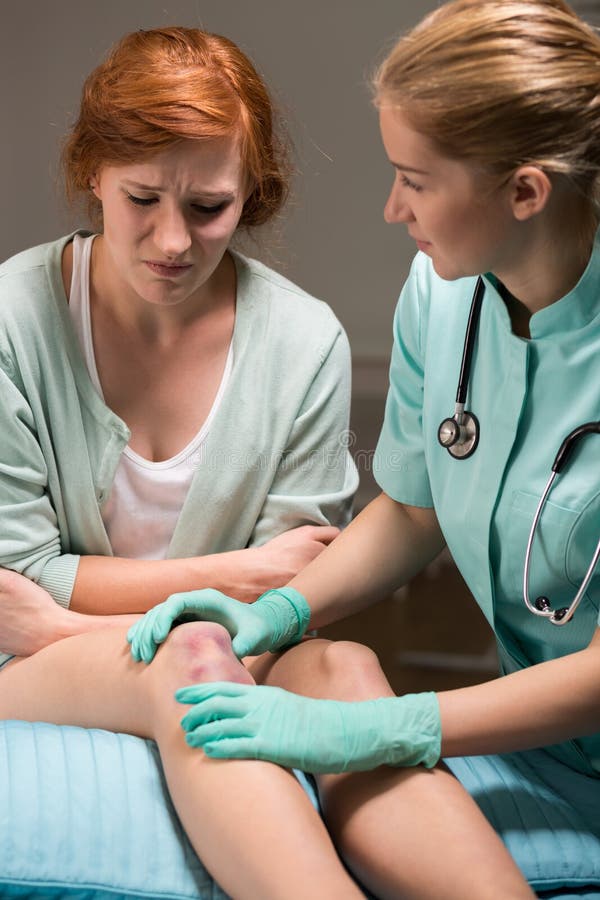 Shot of a focused doctor and her patient in an emergency room. Shot of a focused doctor and her patient in an emergency room