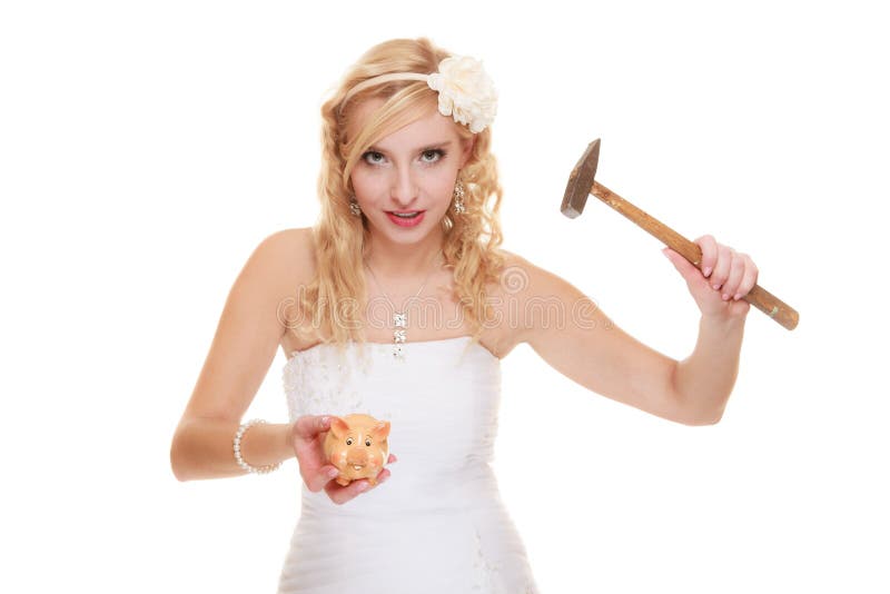 Money saving, marriage and high wedding cost concept. Funny woman bride with hammer about to smash piggy bank isolated on white. Money saving, marriage and high wedding cost concept. Funny woman bride with hammer about to smash piggy bank isolated on white