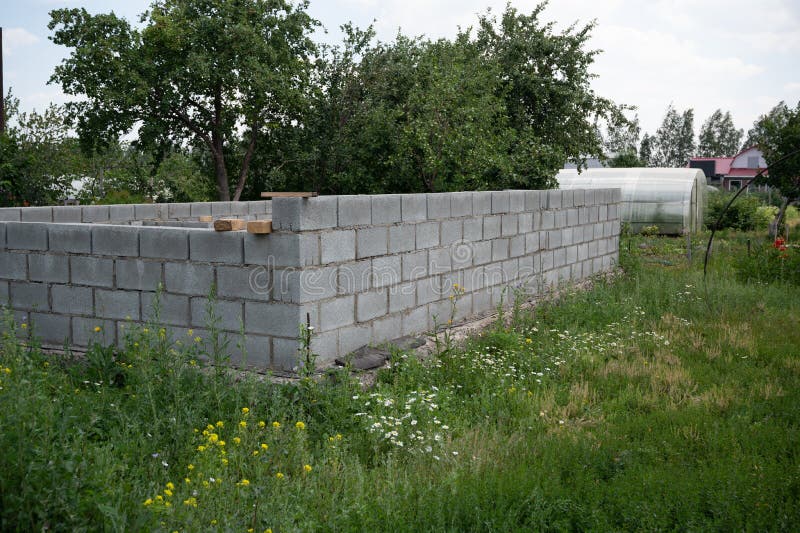 Unfinished house wall at russian dacha. New house construction site. Unfinished house wall at russian dacha. New house construction site