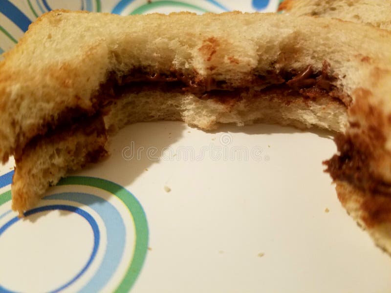 Unfinished Nutella on a Bread, Sweet and old. Unfinished Nutella on a Bread, Sweet and old